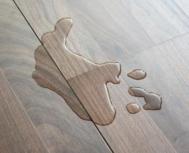 How to fix swollen wood flooring after water damage?
